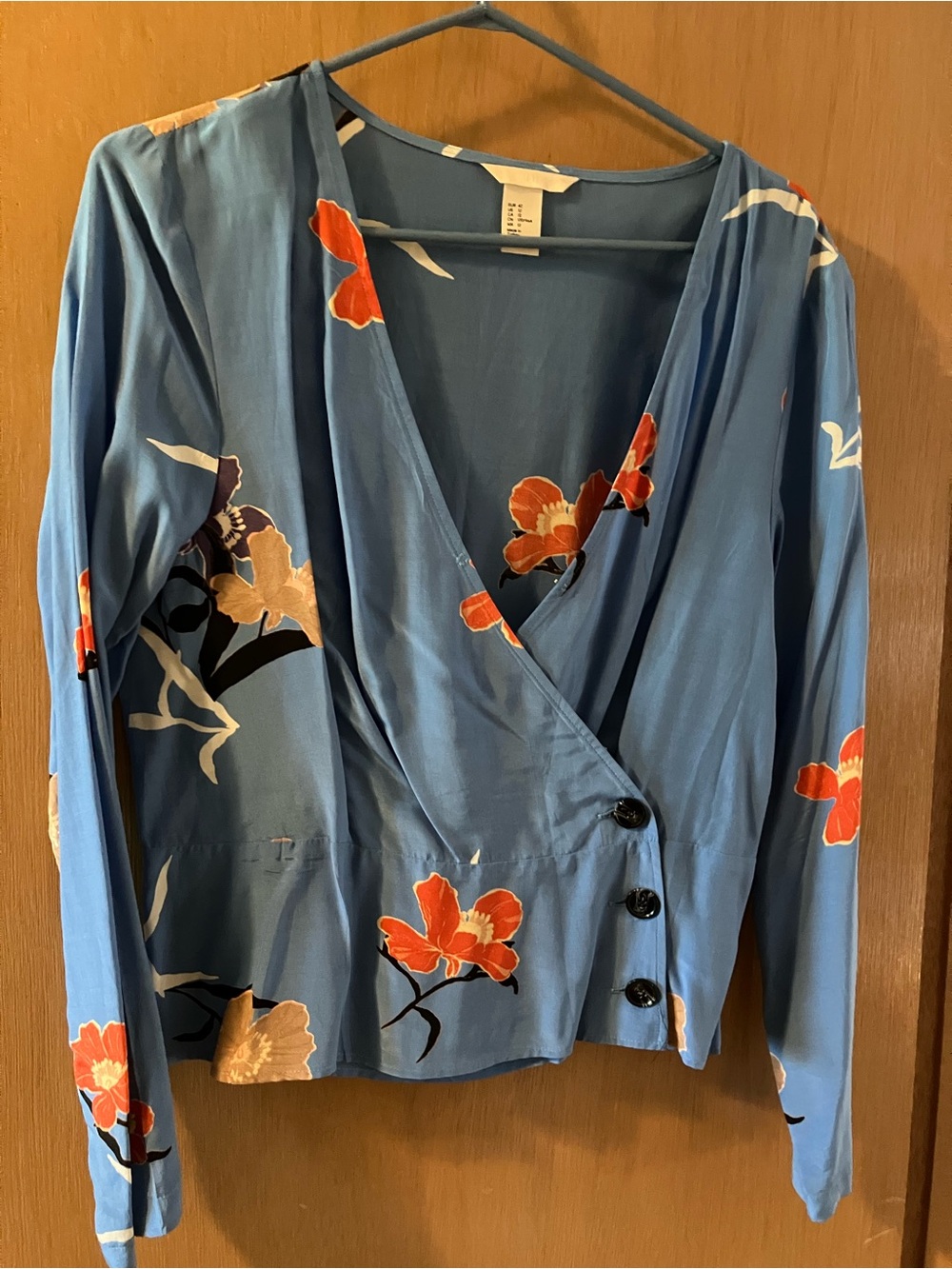 H&M Blue Floral Wrap Blouse with Orange Accents